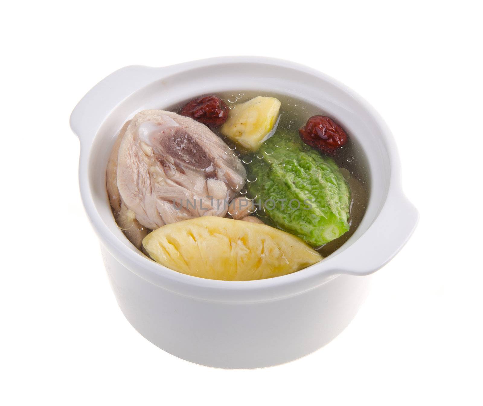 Chicken and herb soup in pot, Chinese food style.