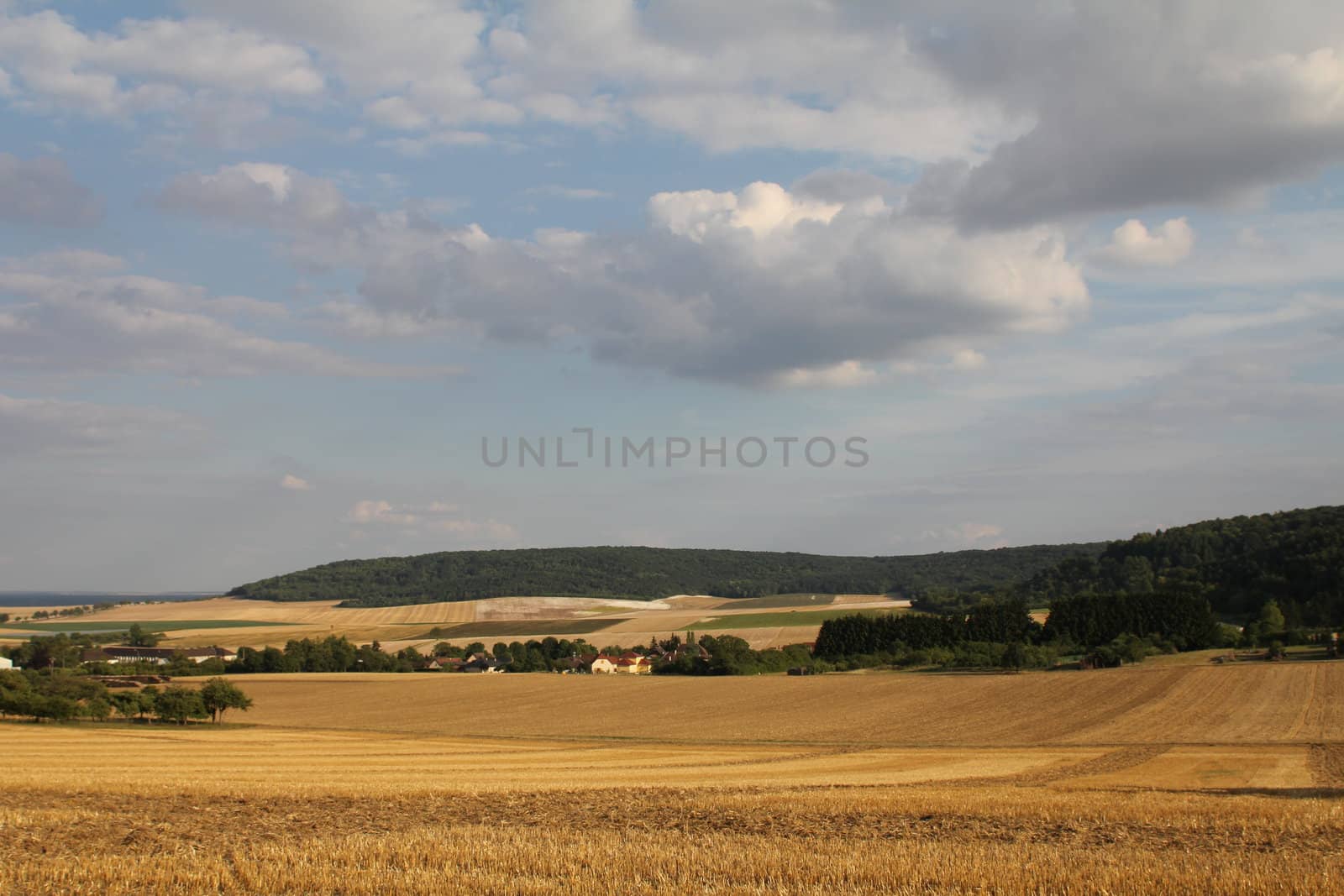 Panorama of northern French countryside and harvested wheat fields
