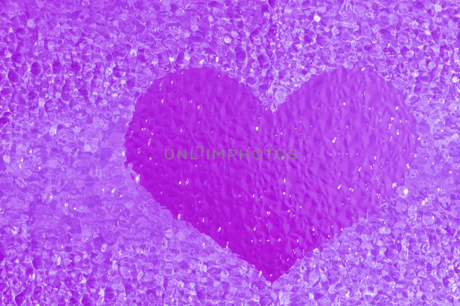 close-up shot of a colorful violet crystal heart bachground
