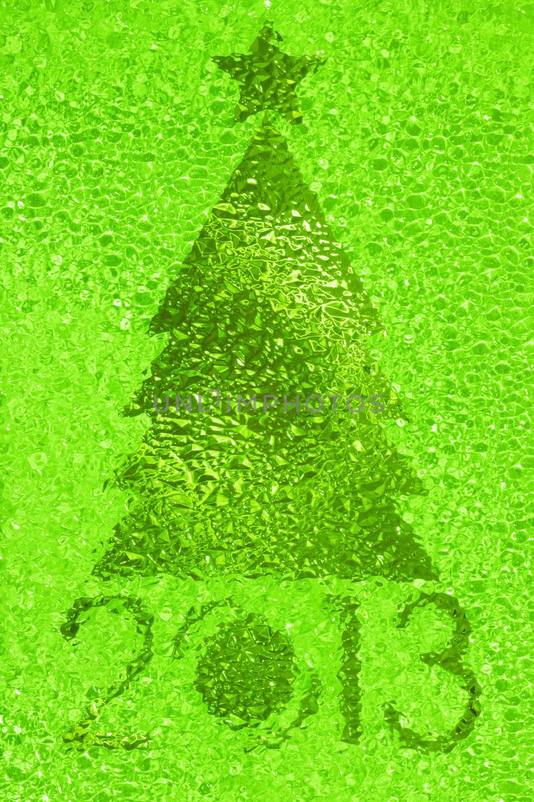 Closeup shot of Christmas tree crystal green background