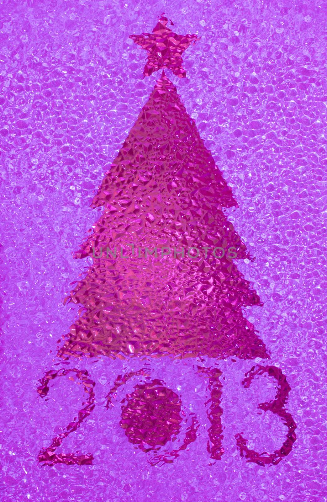 Closeup shot of Christmas tree crystal magenta background