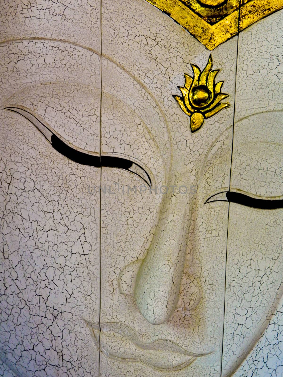 Face of a buddha wood handmade.Sculptures in the temple.