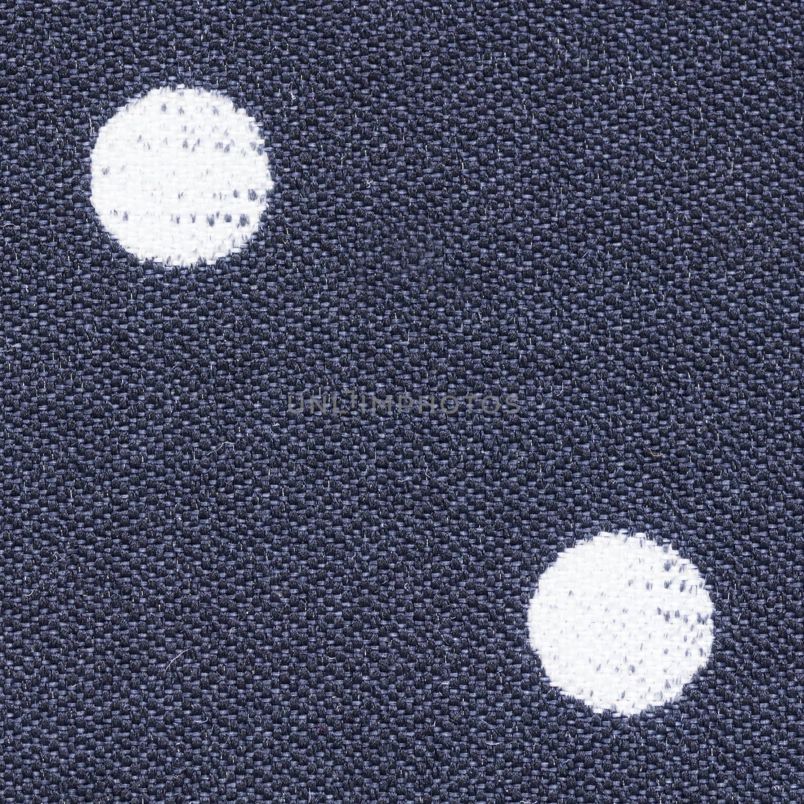 Close up shot of violet polka dot seamless fabric texture