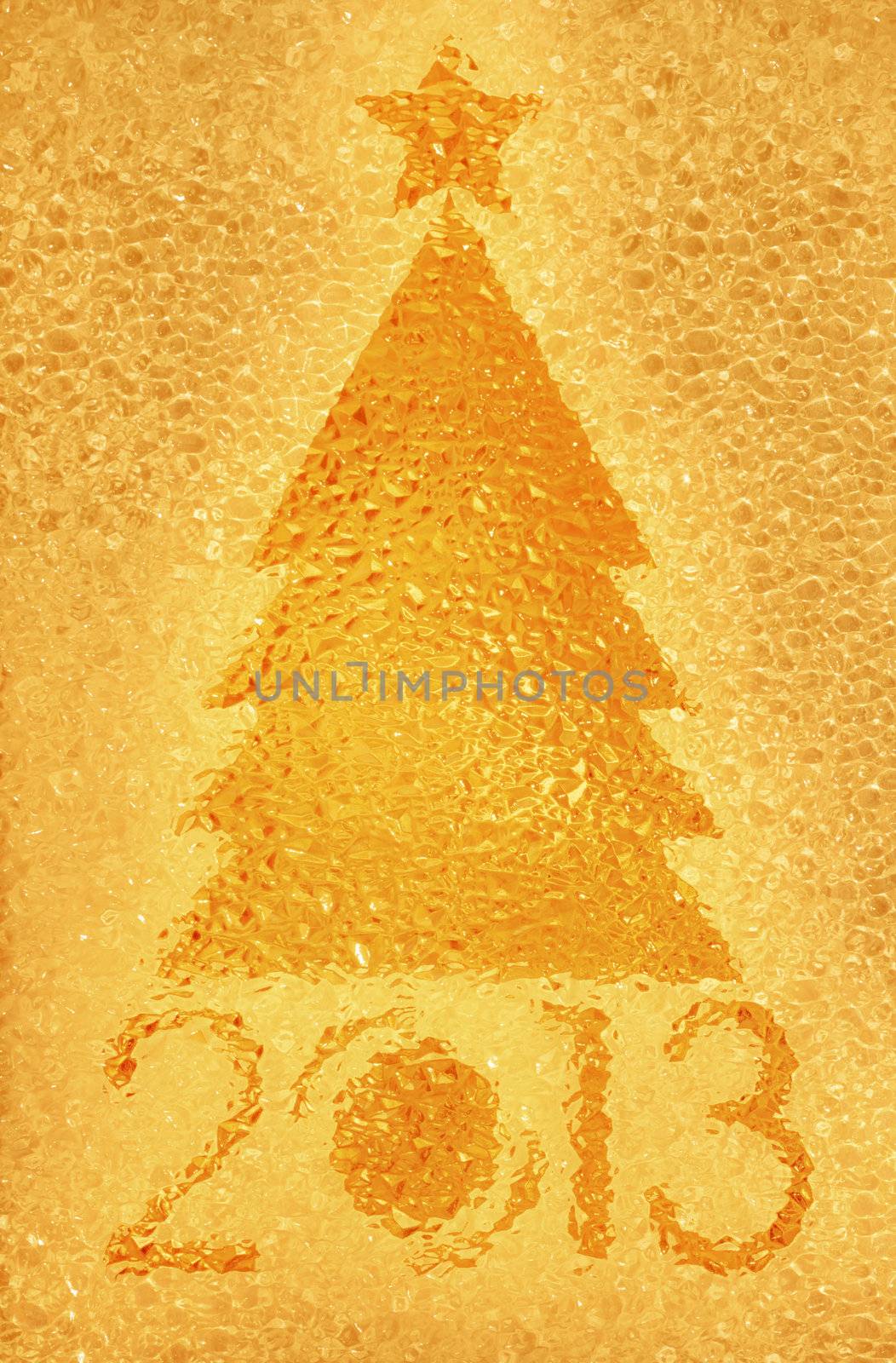 Closeup shot of Christmas tree crystal golden background