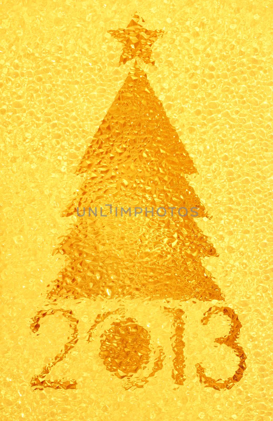 Closeup shot of Christmas tree crystal golden background