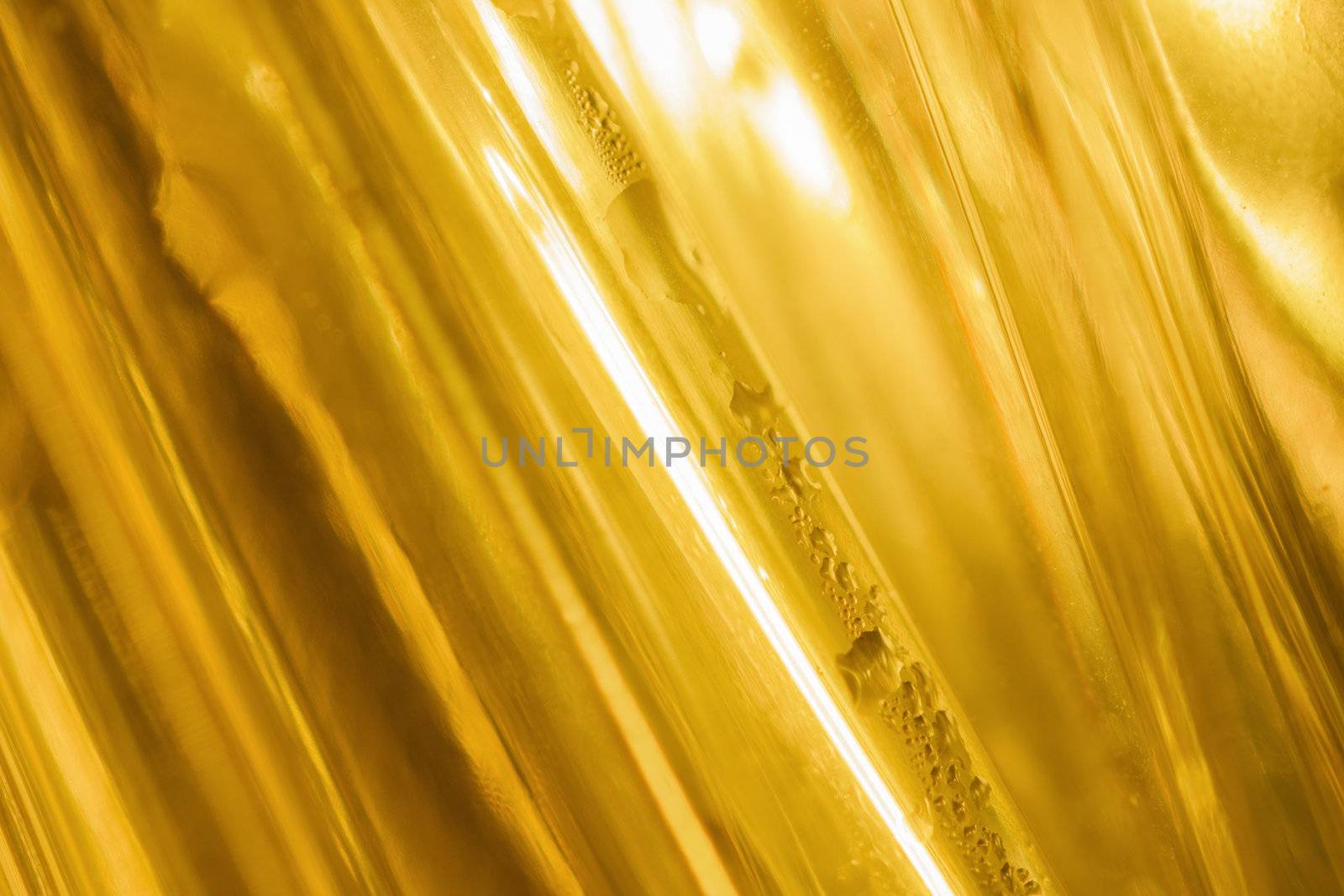 close-up shot of abstract golden glass background