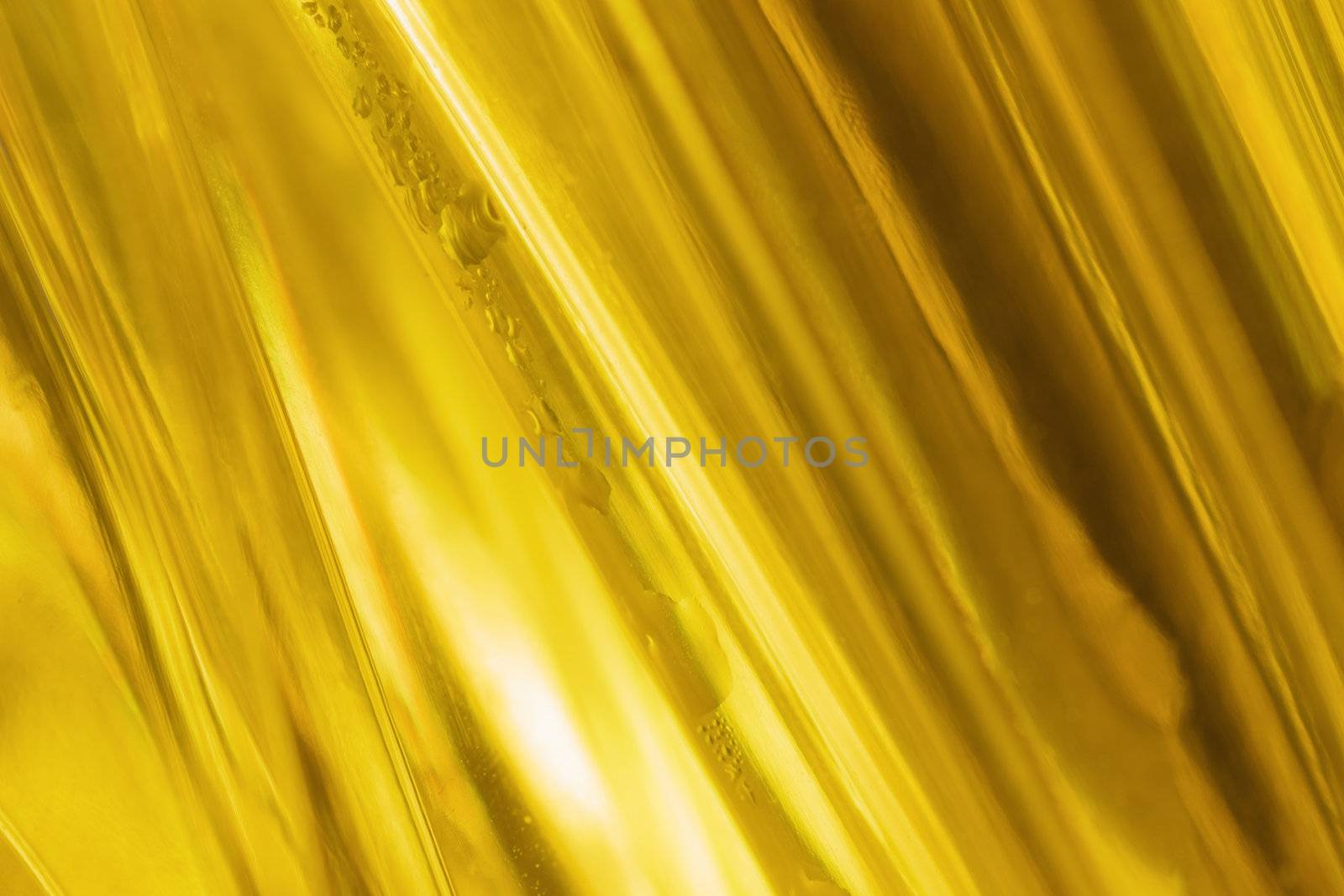 close-up shot of abstract golden glass background