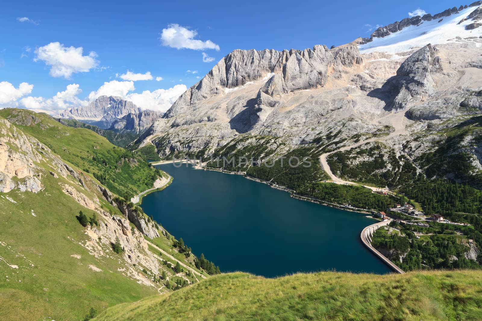 summer view of mount Marmolada and Fedaia lake, Trentino, Italy