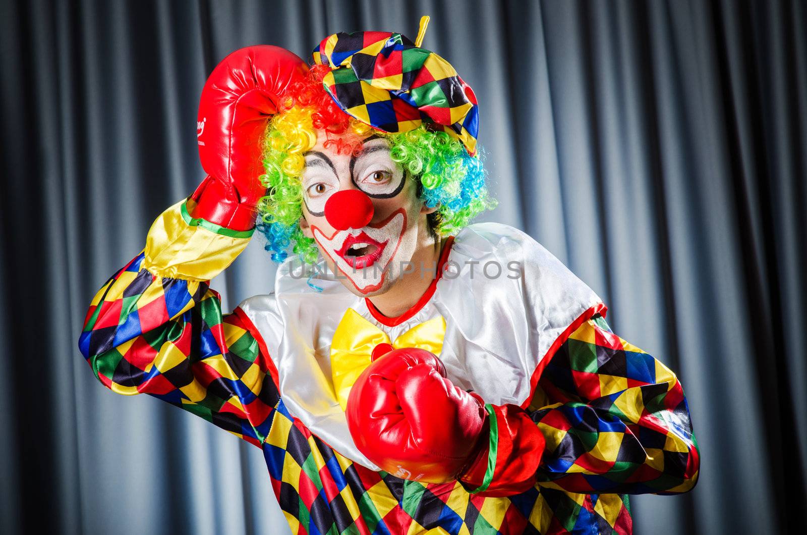 Funny clown in the studio shooting by Elnur