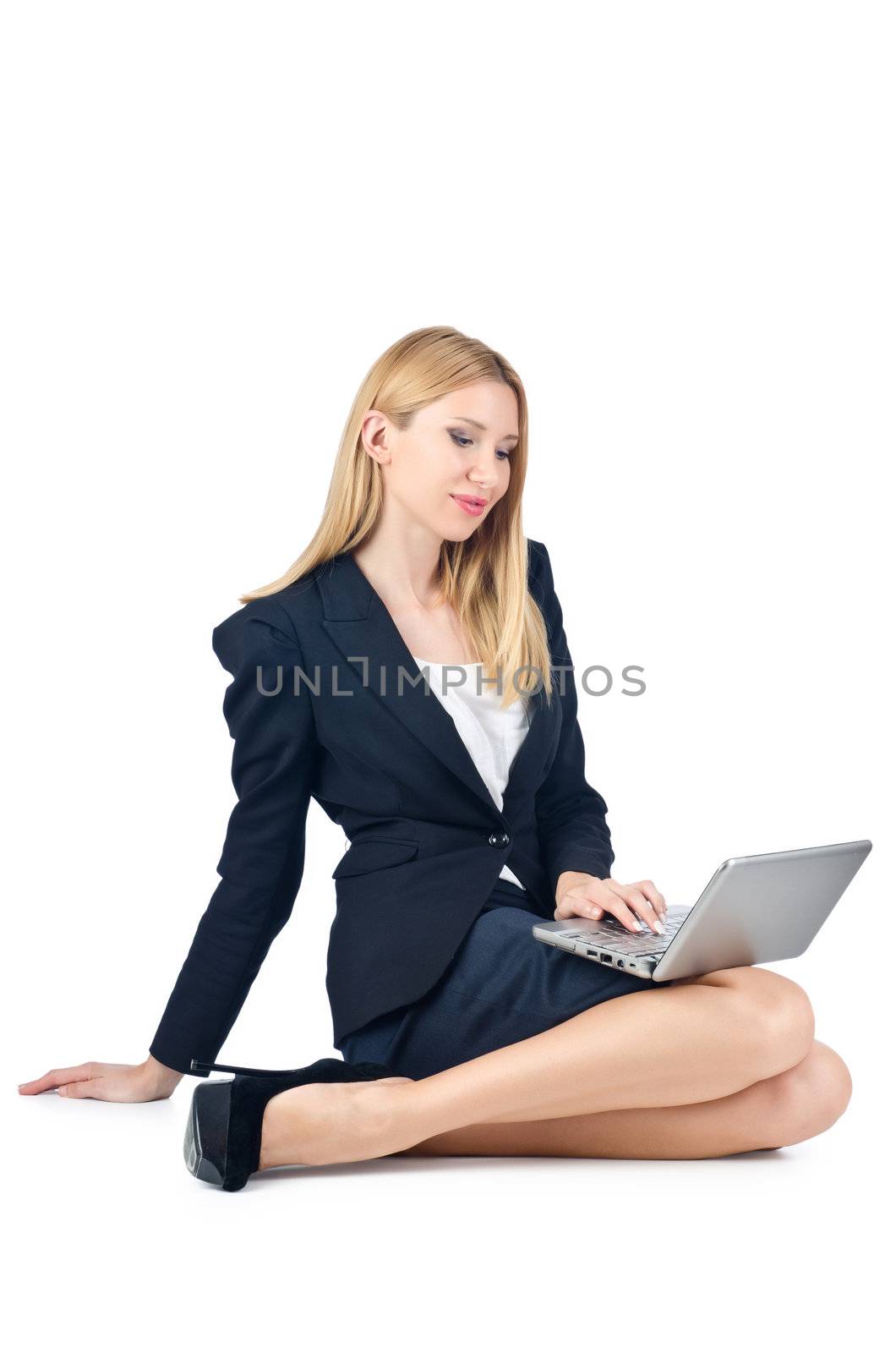 Businesswoman sitting on floor with laptop by Elnur