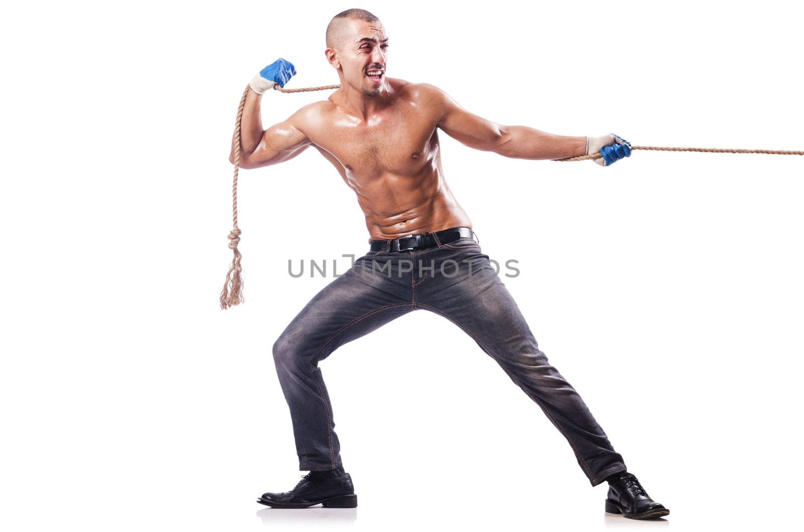 Muscular man pulling the rope by Elnur