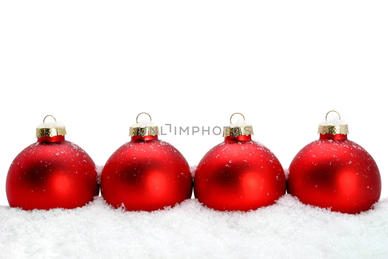 Decorative Christmas glass ornaments on the snow by lobzik