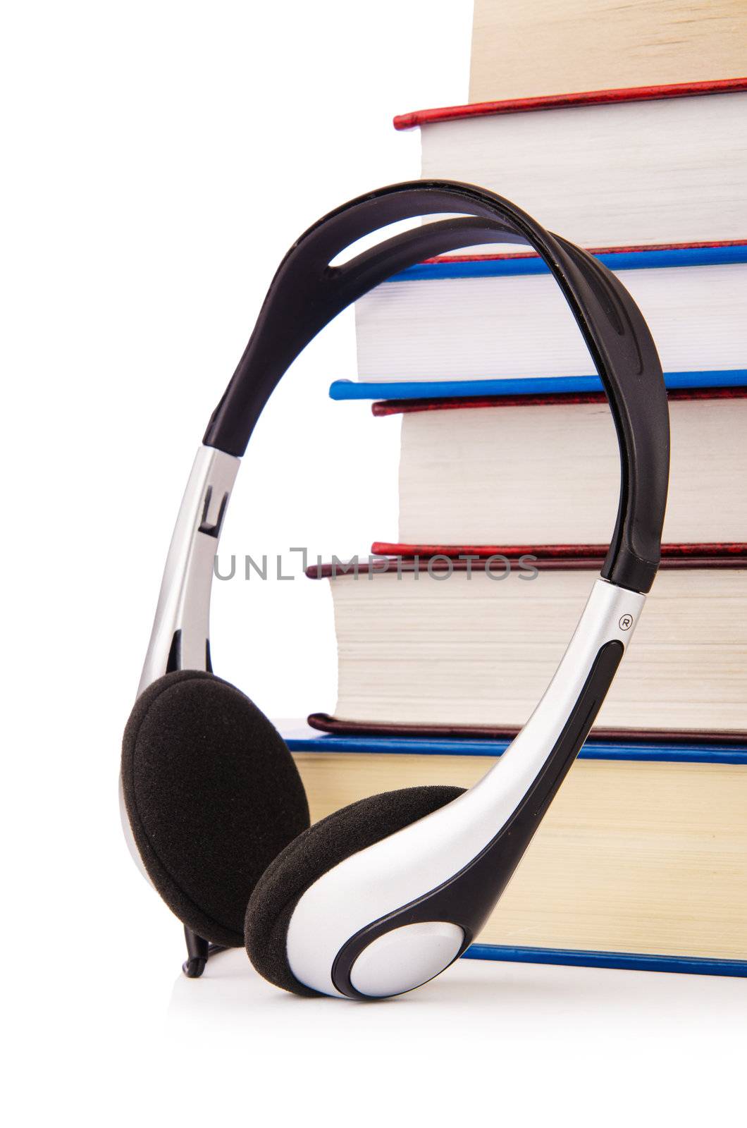 Concept of audio books with earphones on white by Elnur