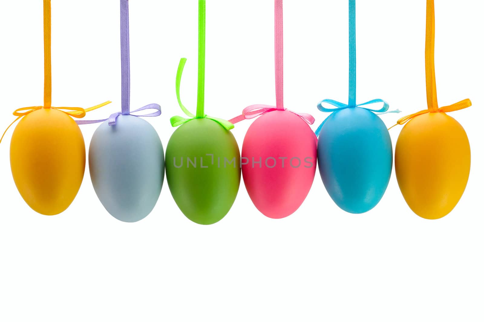 Colorful Easter eggs hanging on ribbons. Isolated.