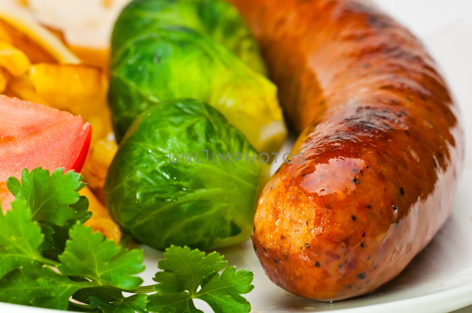 German sausage with potatoes, cabbage and other vegetables.