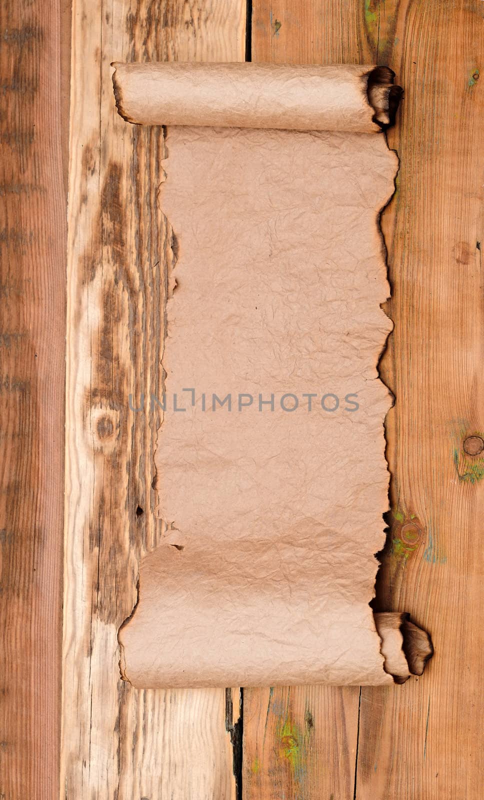 blank old scroll on wooden table