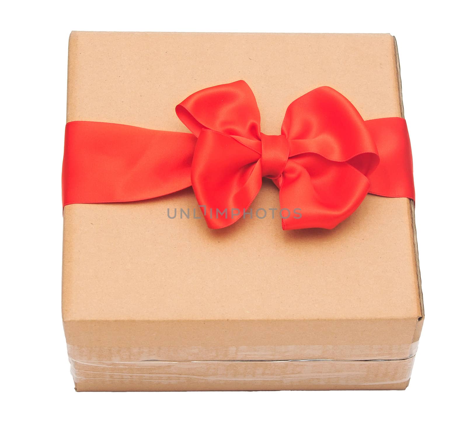 red ribbon bow on cardboard box. holidays background