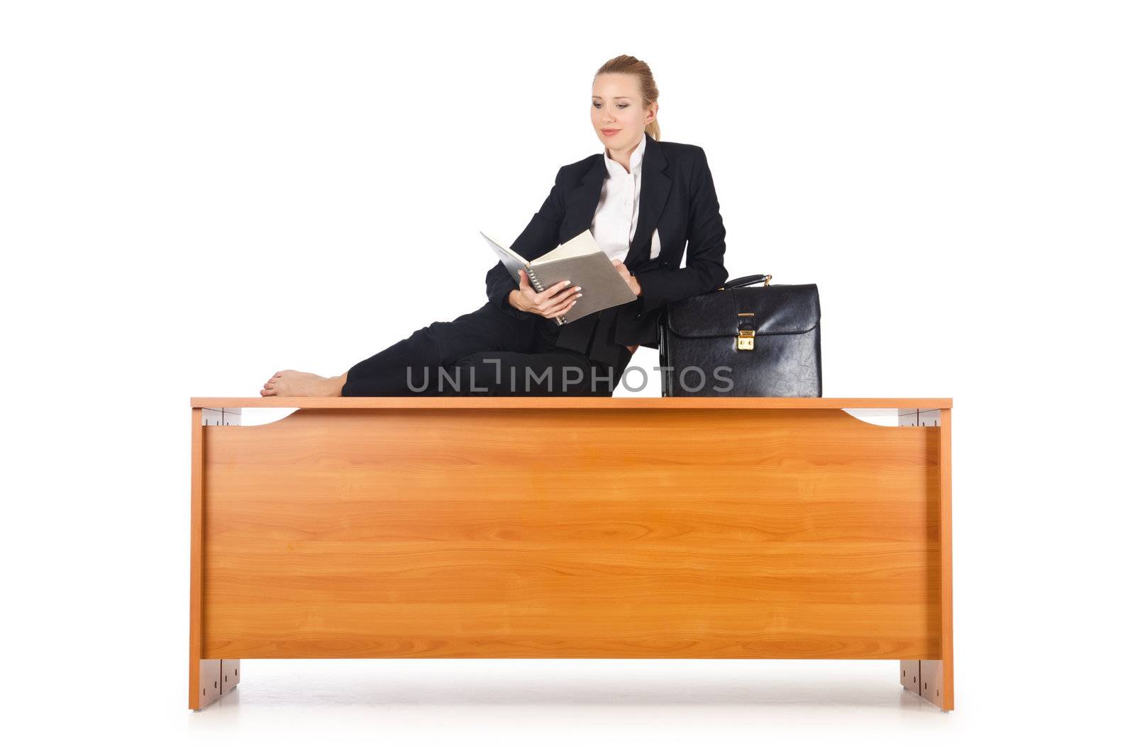 Woman businesswoman sitting on the desk by Elnur