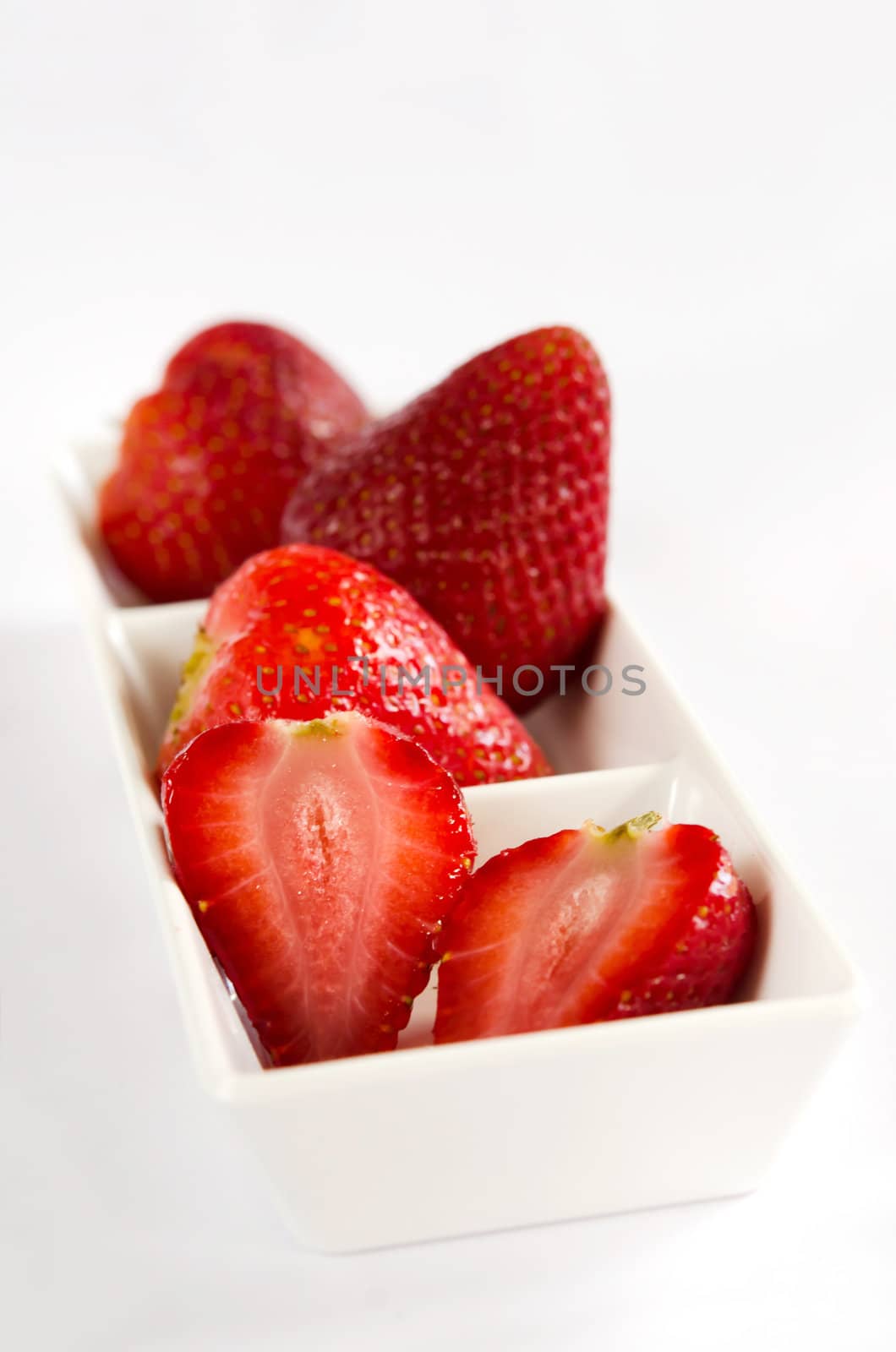 fresh ripe strawberry on white bowl
