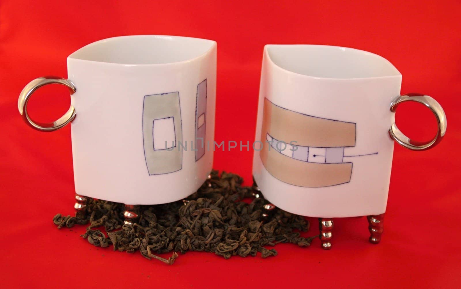 Two cups with leaf green tea