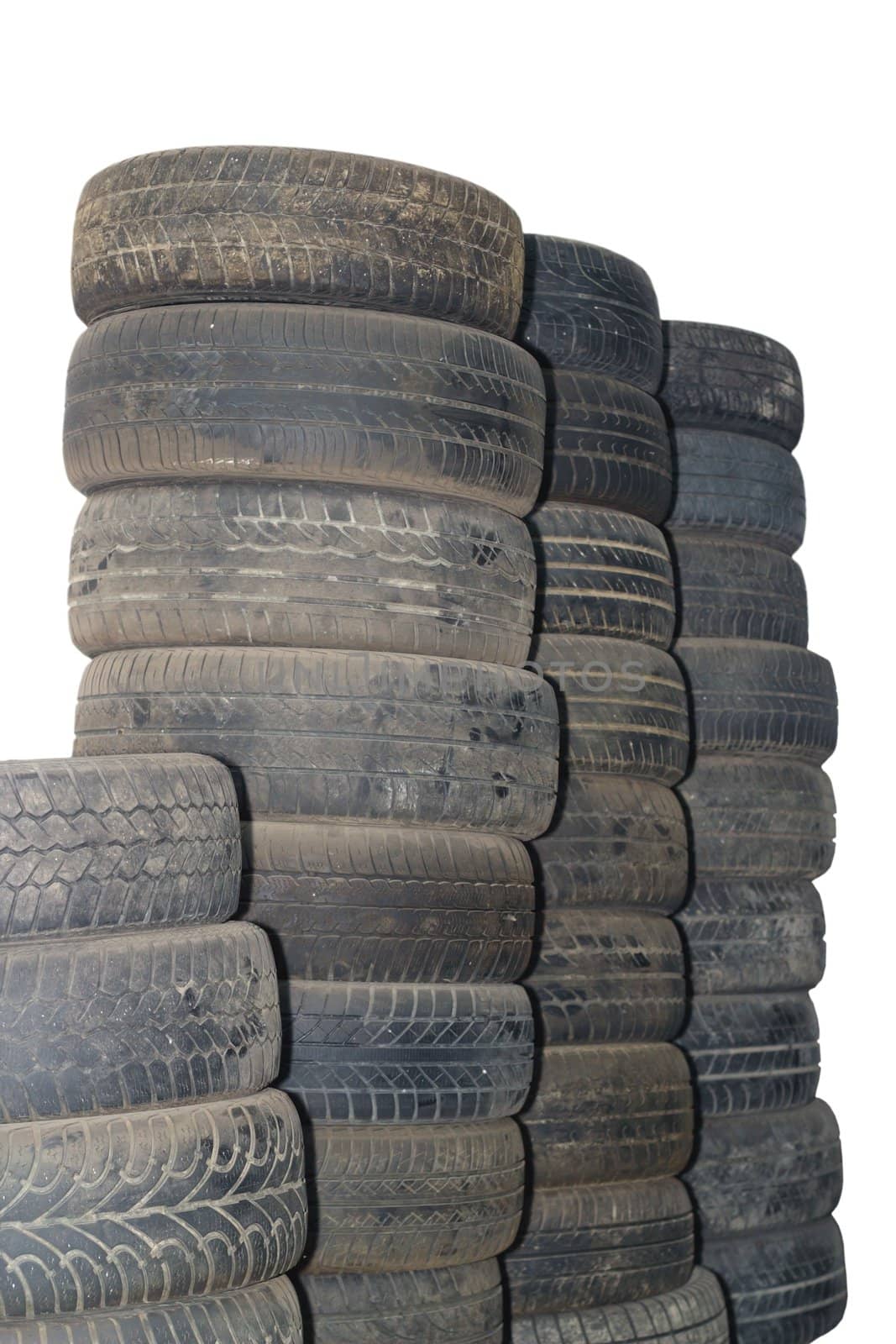 bunch of old used auto tires isolated over white background