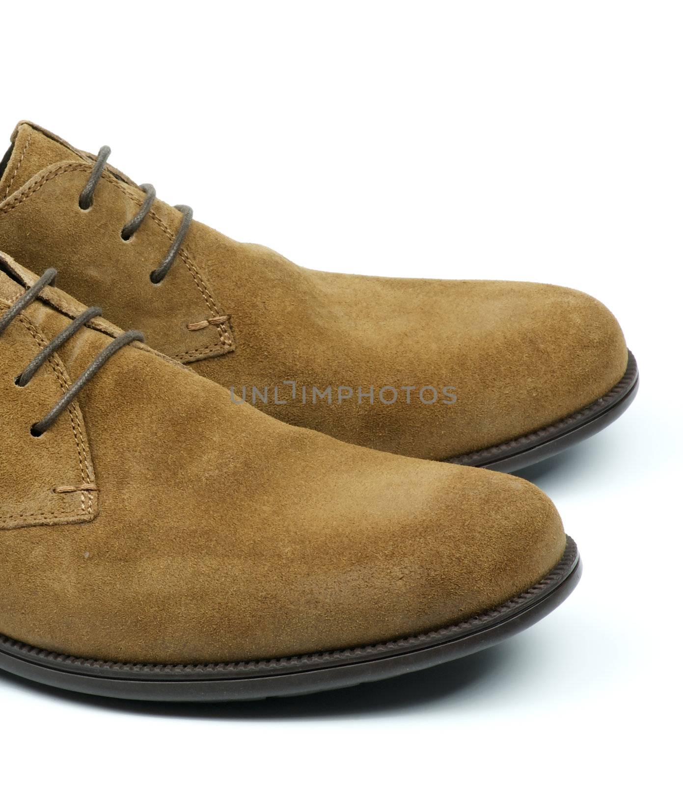 Part of Men's Beige Chamois Leather Shoes closeup on white background