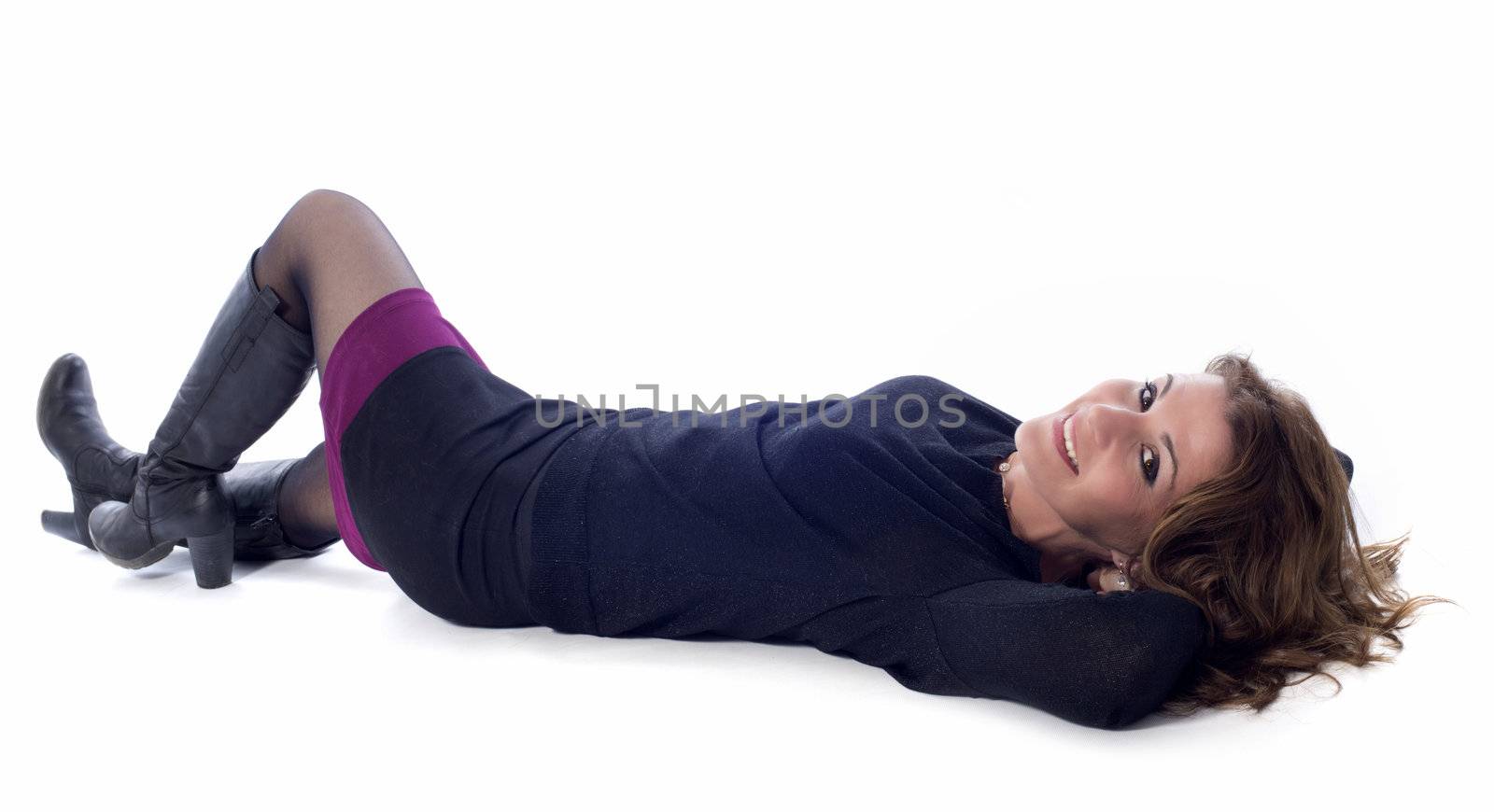beautiful smiling woman laid down in front of white background