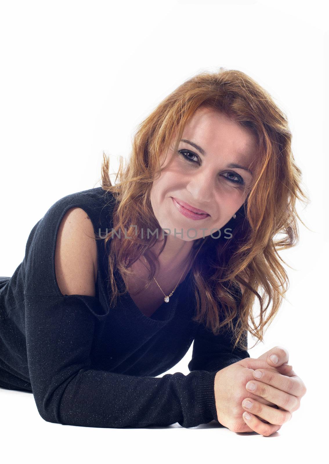 beautiful smiling woman laid down in front of white background