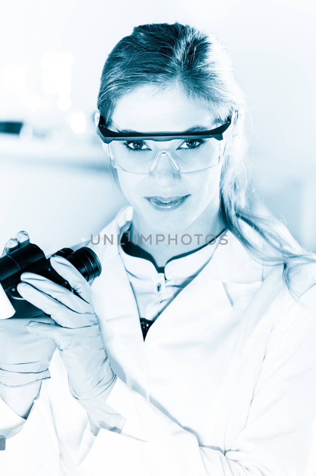 Black and white portrait of a attractive, young, confident female health care professional in hes working environment.