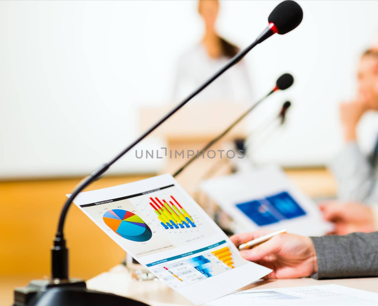 close-up microphone, on the background of business communication at the conference