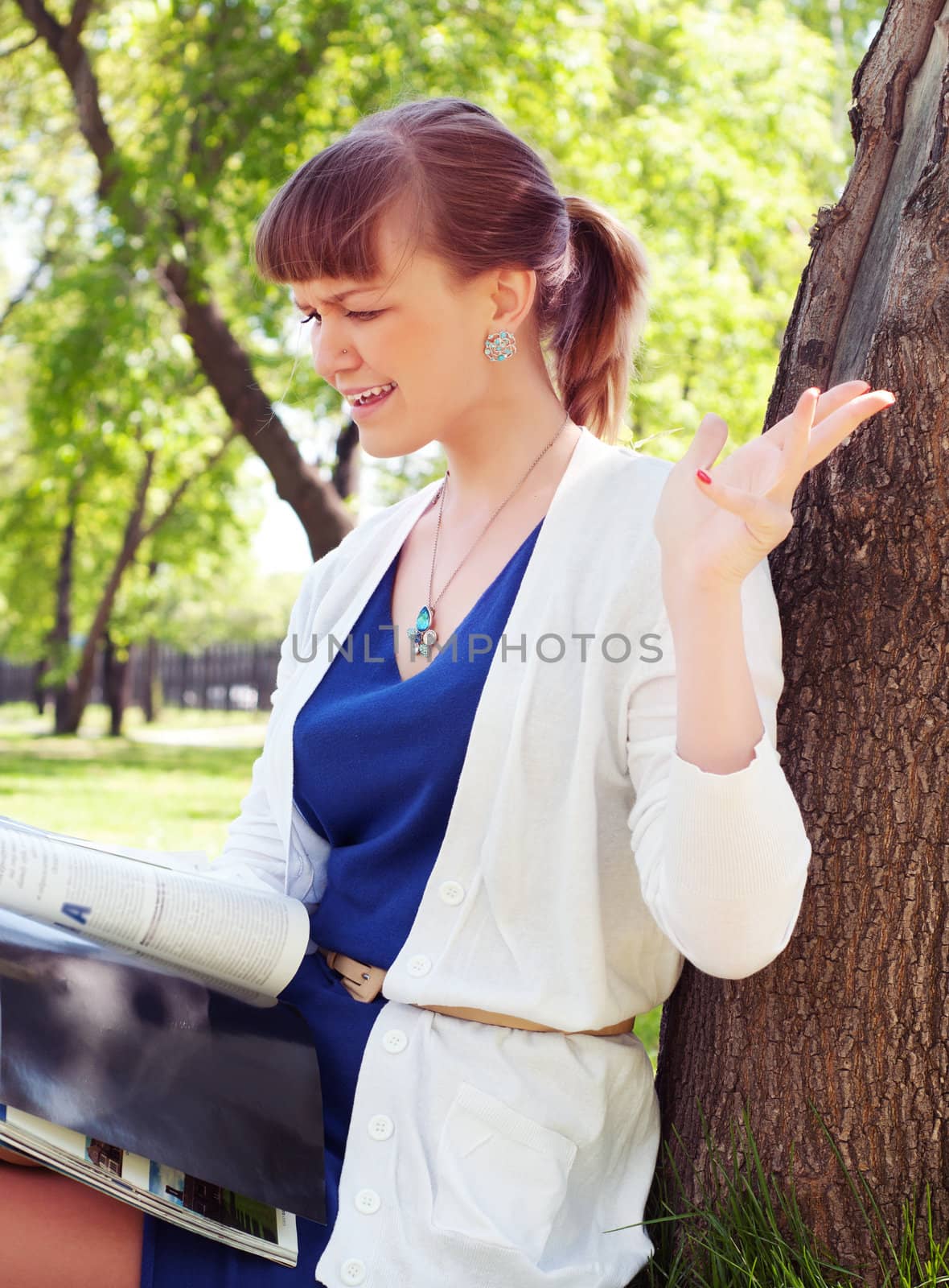 portrait of a beautiful woman, spending time in a summer park