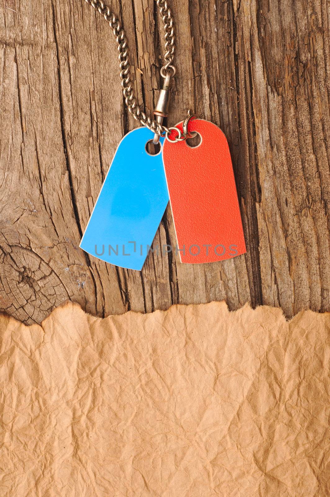 blank tags blue and red with silver chain on vintage background