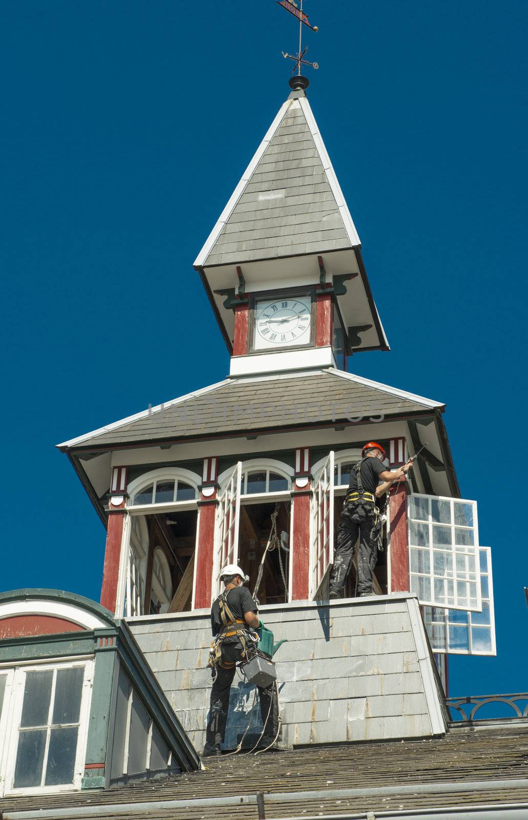 Copenhagen, Denmark - August 2012. Workers repair a roof of the old building.