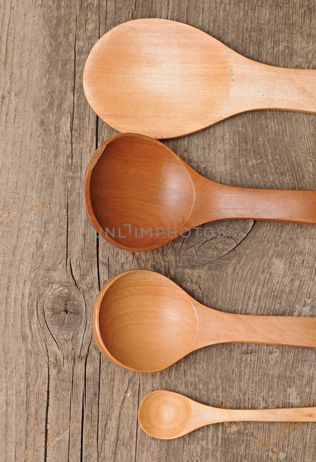 wood spoon as utensils on wooden background 