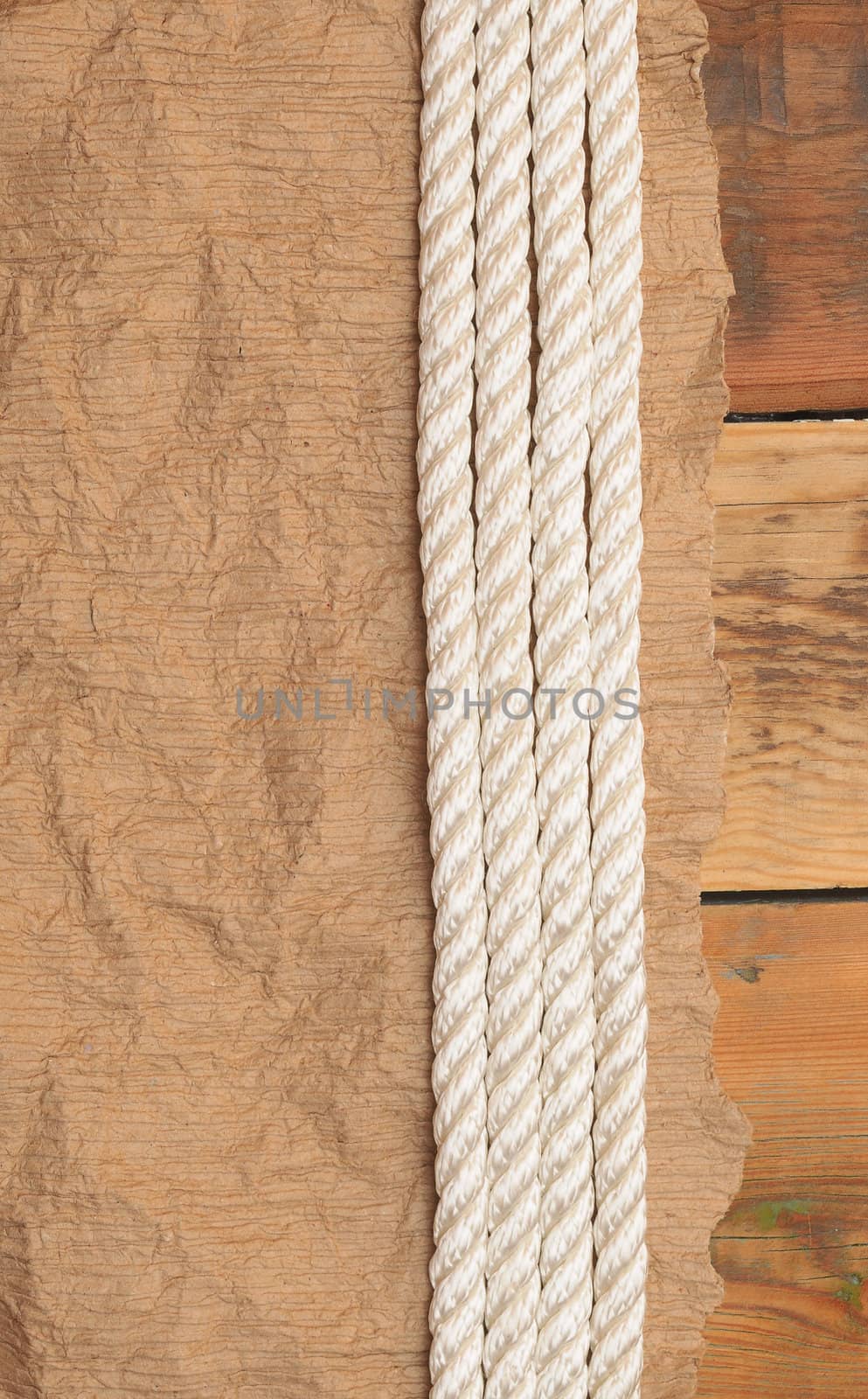 Vintage paper and rope on old wooden boards 