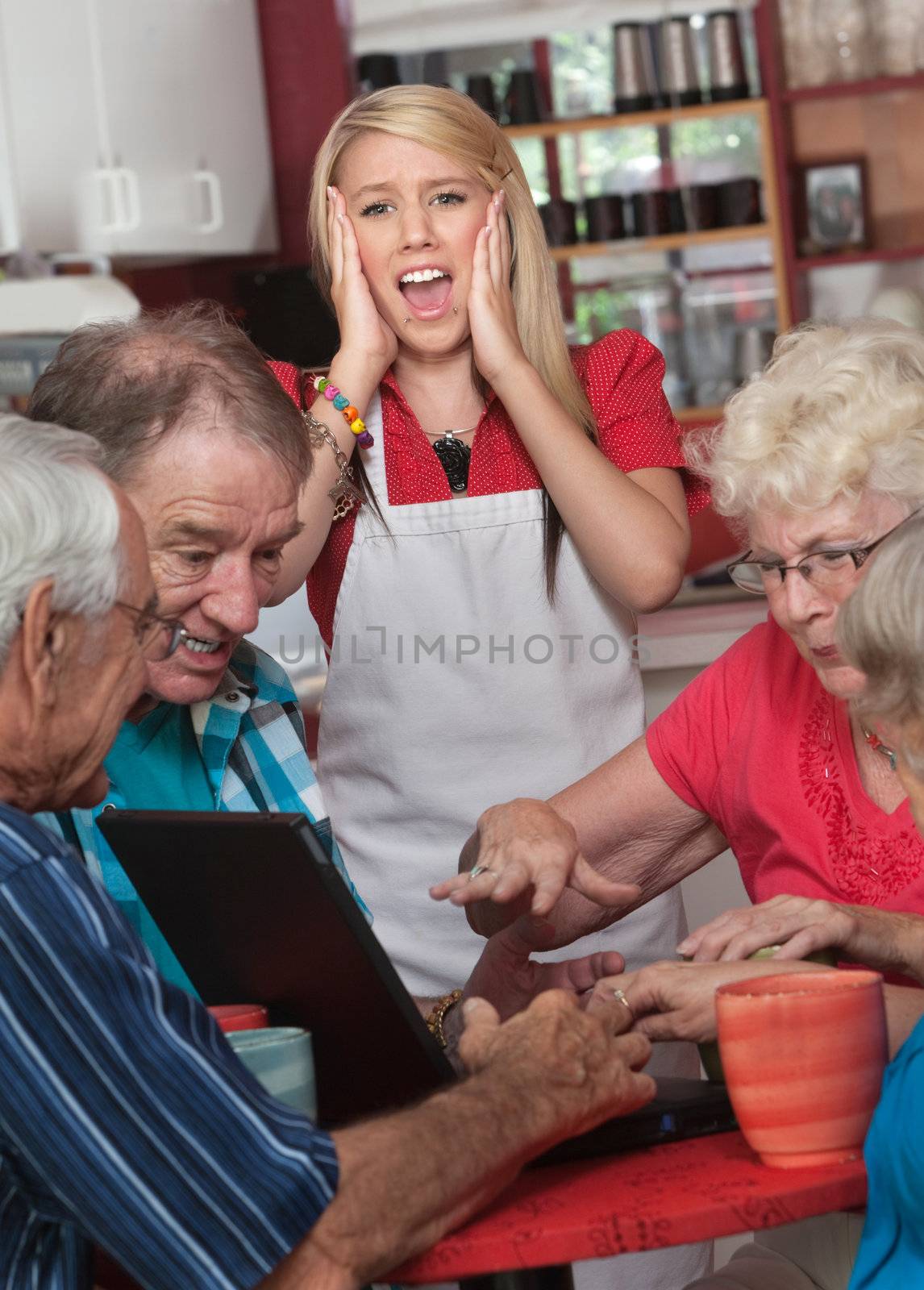 Screaming waitress with upset group of seniors on computer