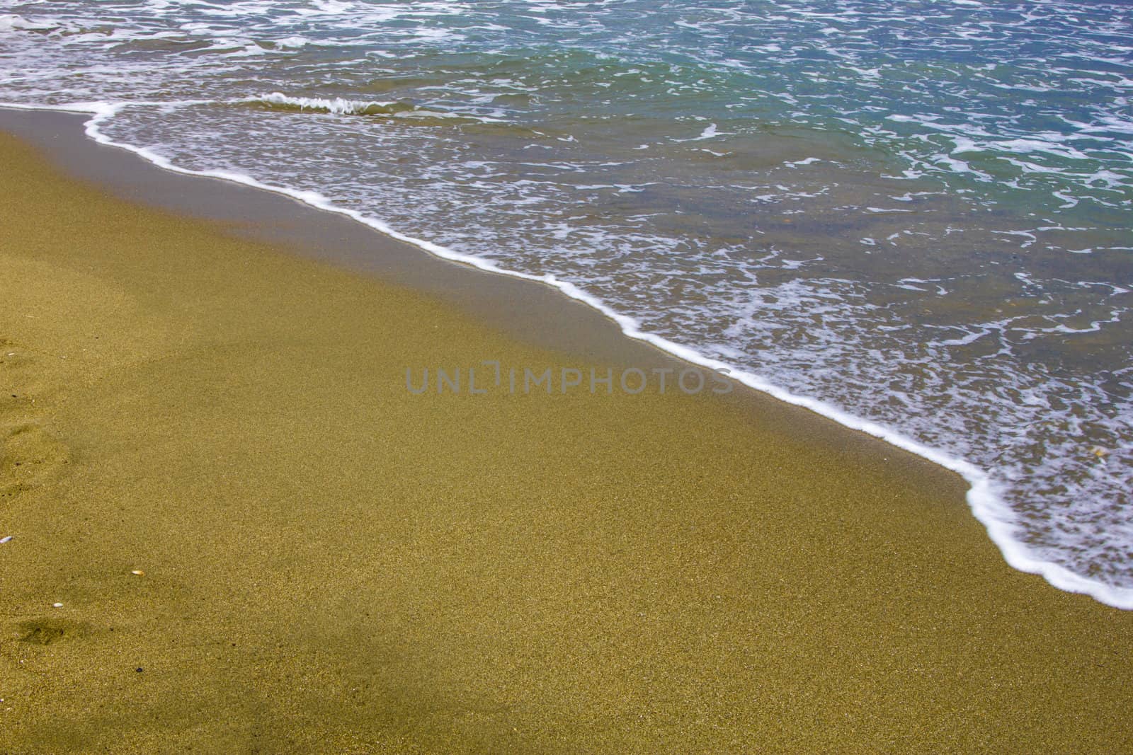 Sea wave on golden beach sand in sunset by huntz