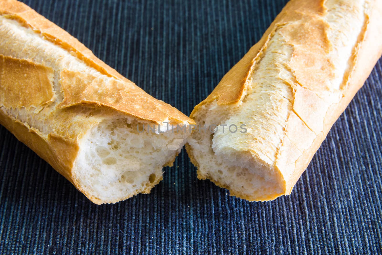 Closeup of french baguette over a black cloth