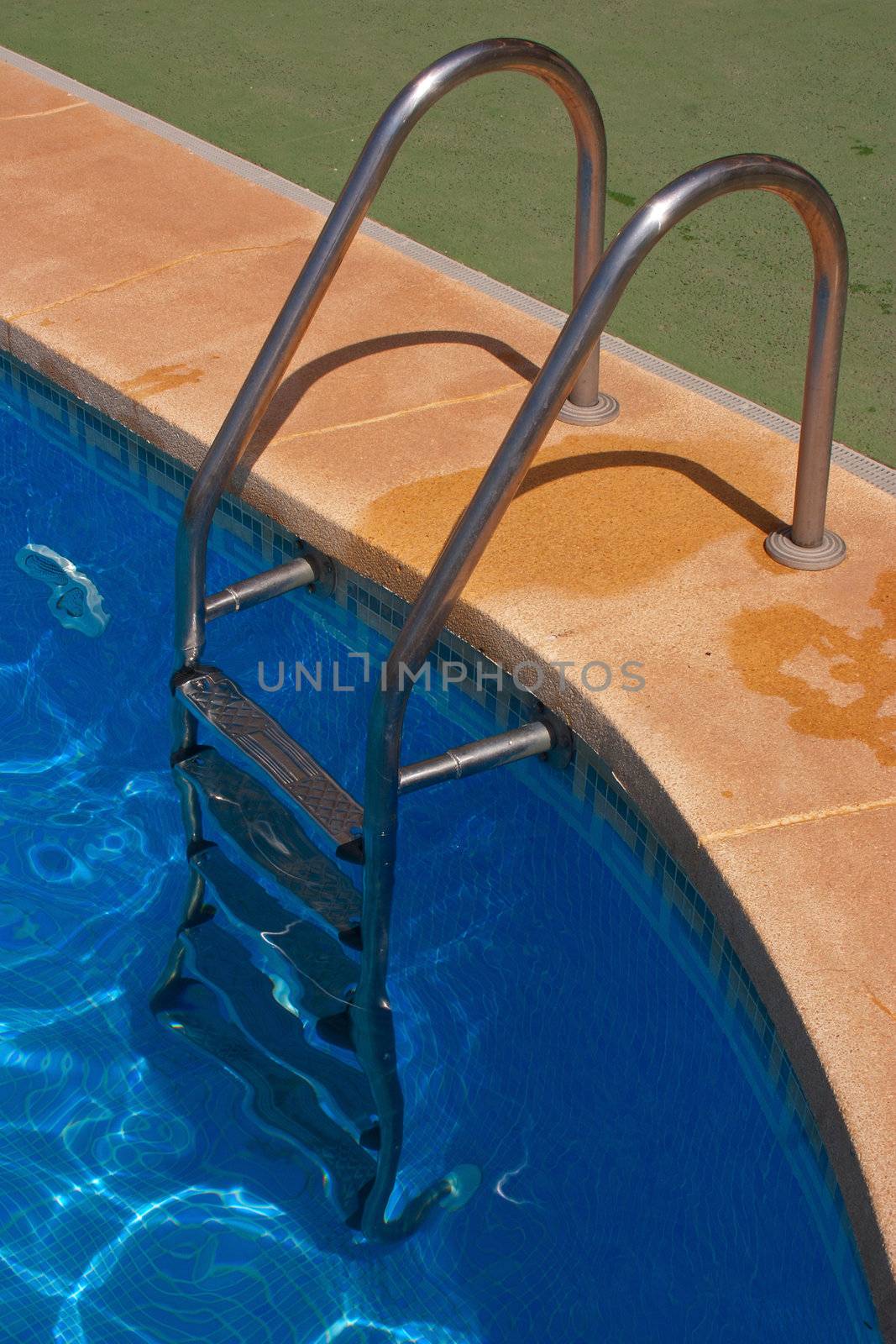 Staircase at the border of a swimming pool