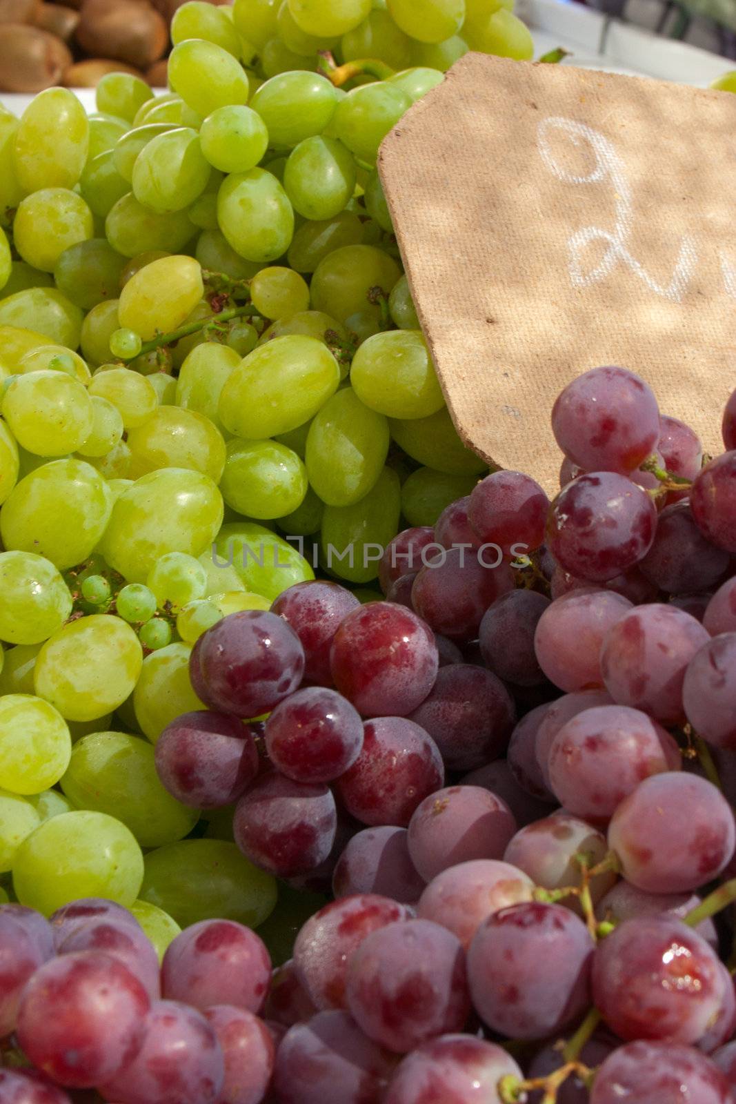 White and blue grapes at the local market