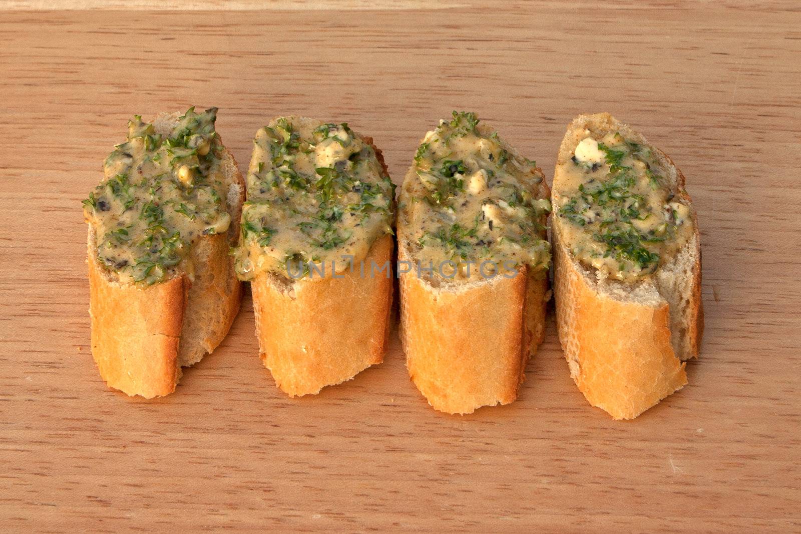 Garlic breads on a breadboard