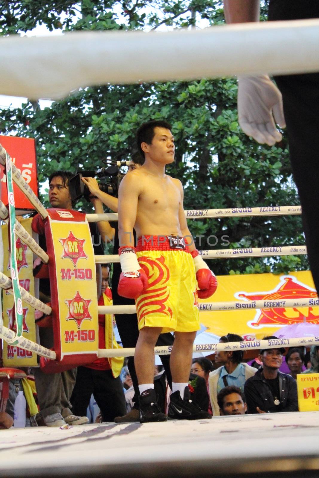SURAT THANI, THAILAND - DECEMBER 14 : Decha Kokietgym wait to fight boxig with Chenyujie on December 14, 2012 in Surat Thani, Thailand.