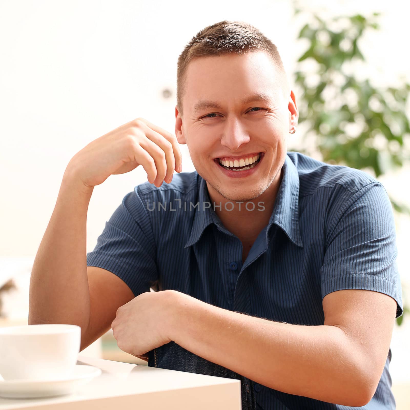 Portrait of young and happy smiling guy by rufatjumali