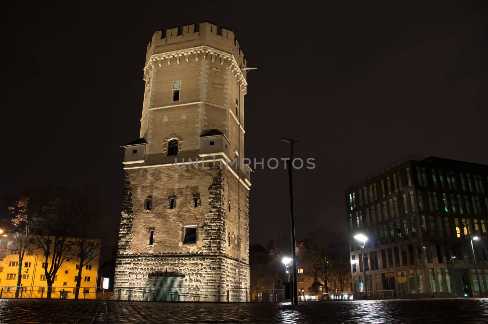 Ancient Bayenturm in Cologne, Germany, at night