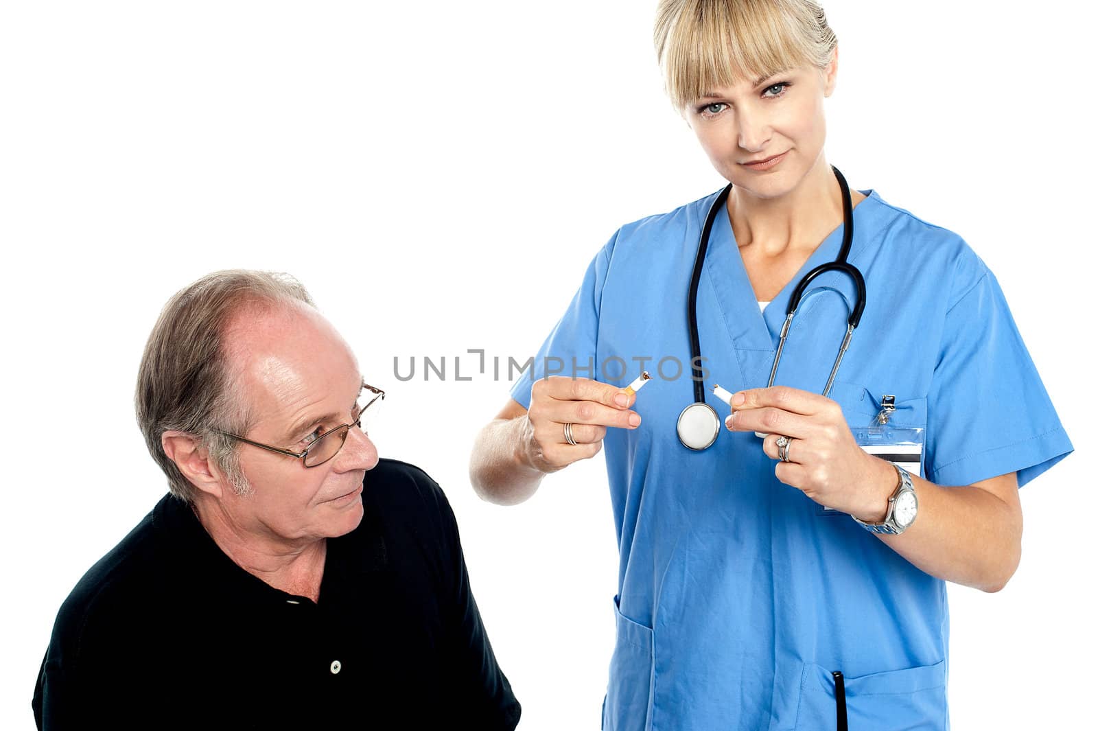 Doctor breaking cigarette. Its injurious to health.