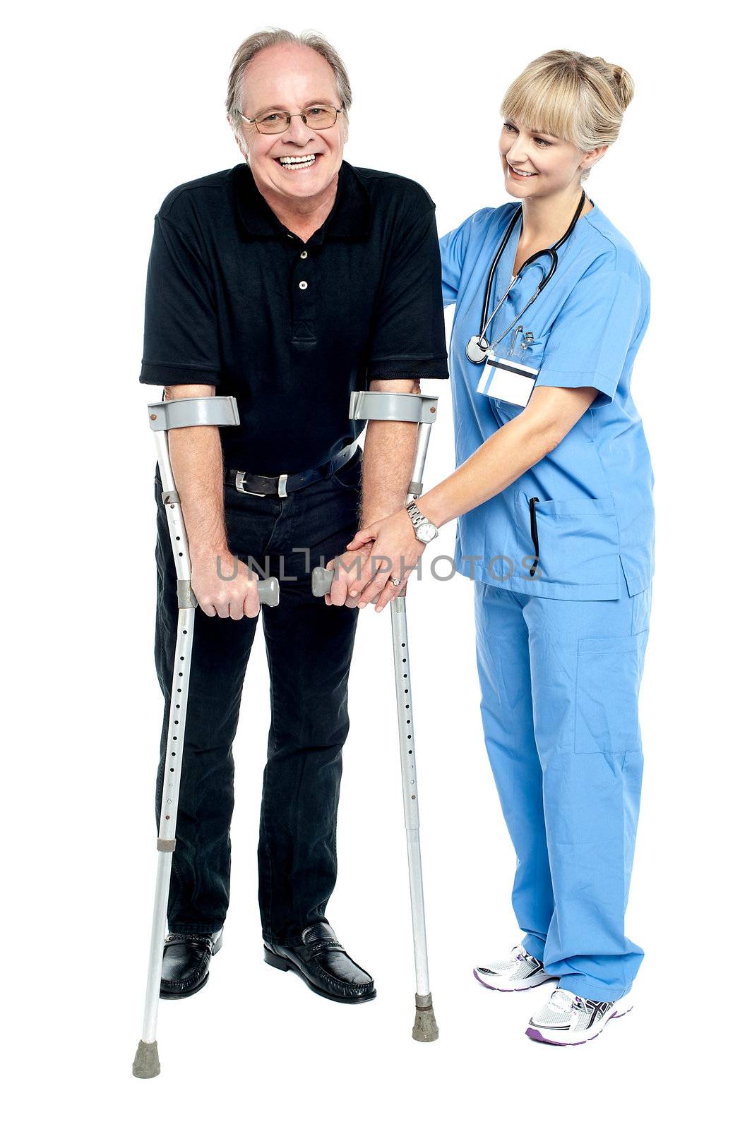 Experienced physician assisting her patient in recovery process by stockyimages