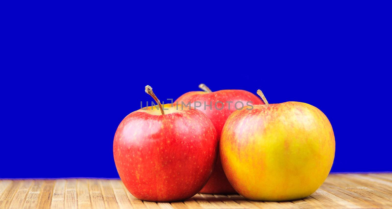 apple lying on a bamboo napkin