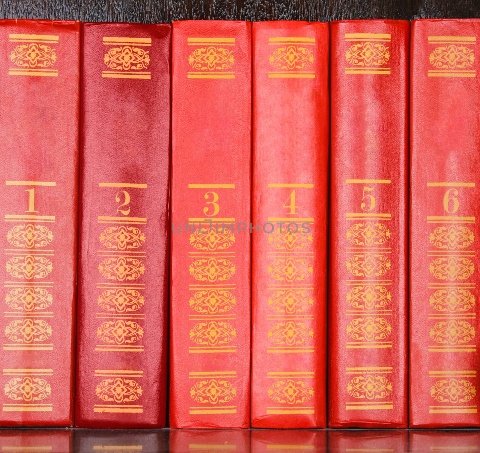 Red books standing in a row by sfinks