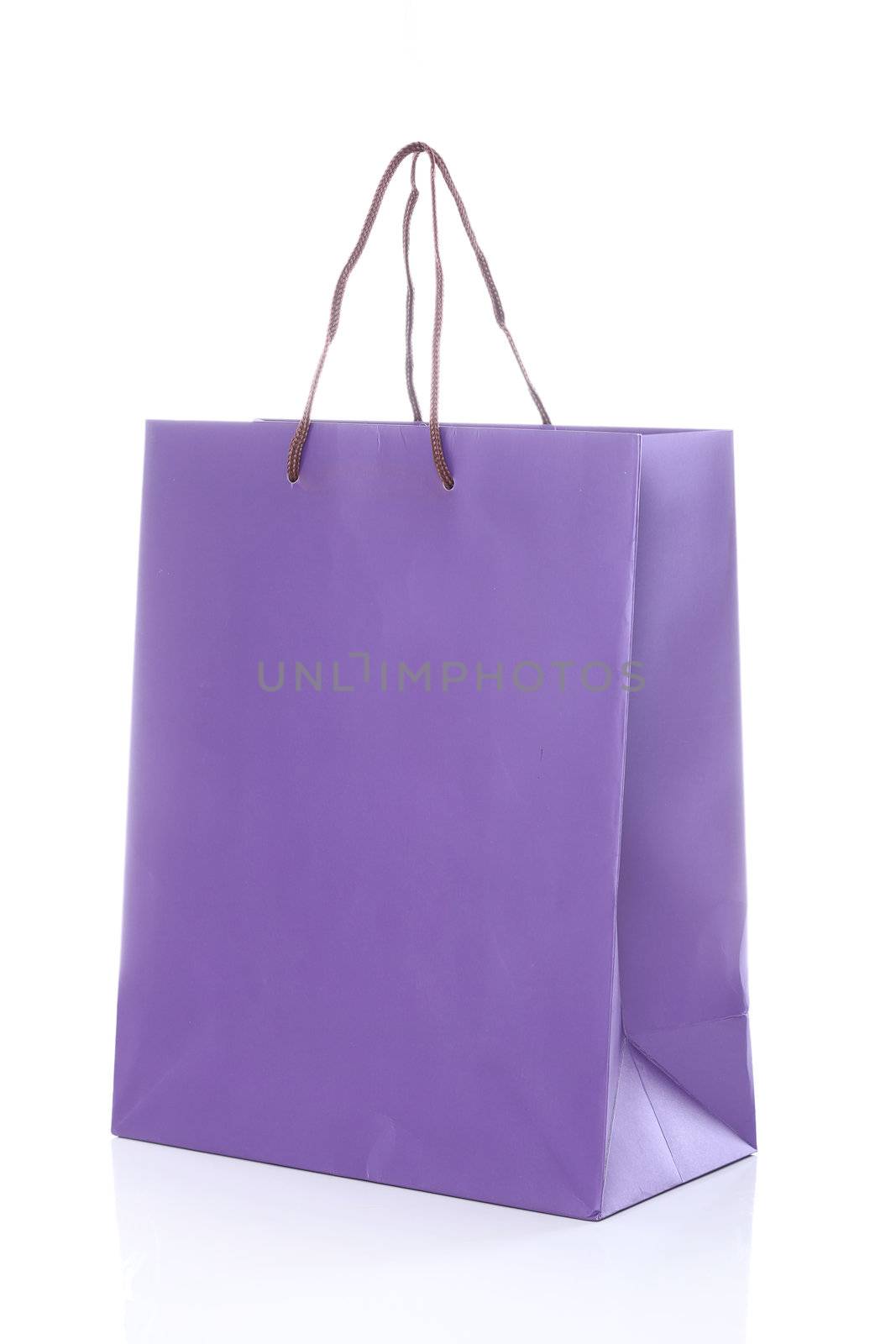 Close up of one purple shopping bag isolated on a white