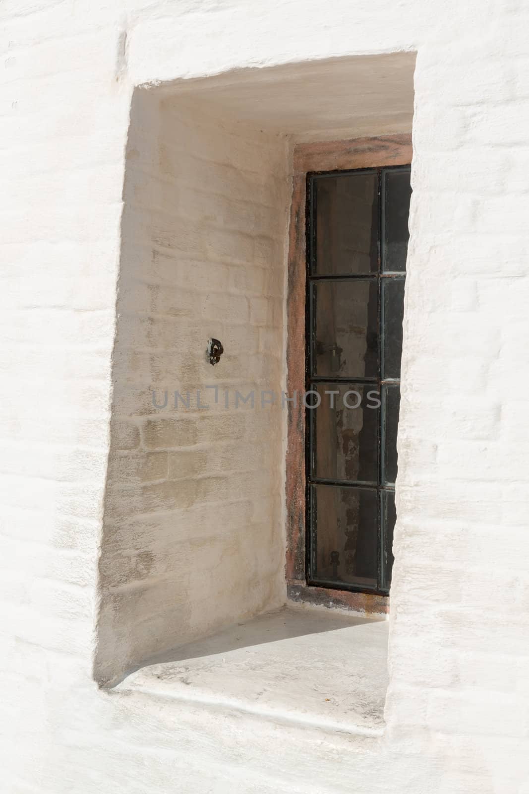 Window set in thick walls of Cape Florida Lighthouse in Bill Baggs State Park in Key Biscayne Florida